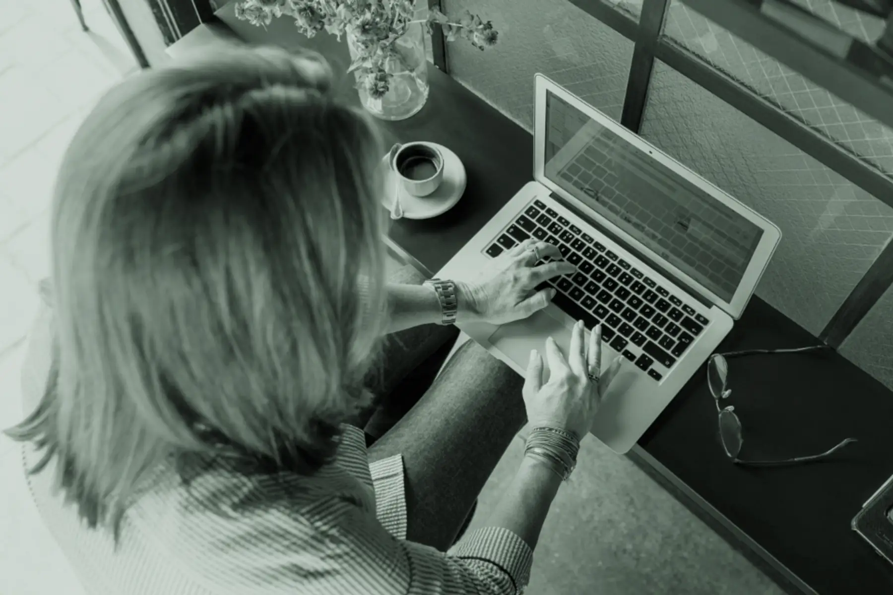 An administrator working through documents at a desk